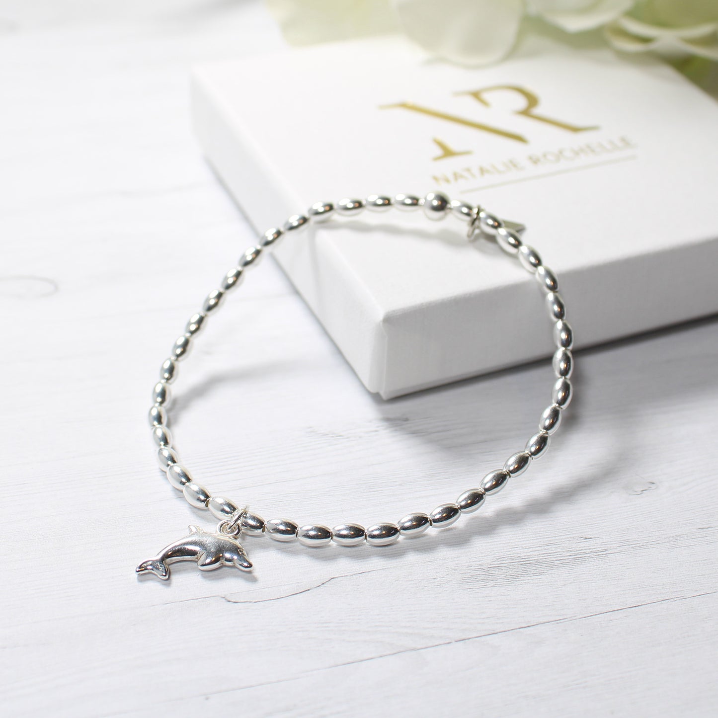 Sterling Silver Oval Bead Bracelet with Dolphin Charm